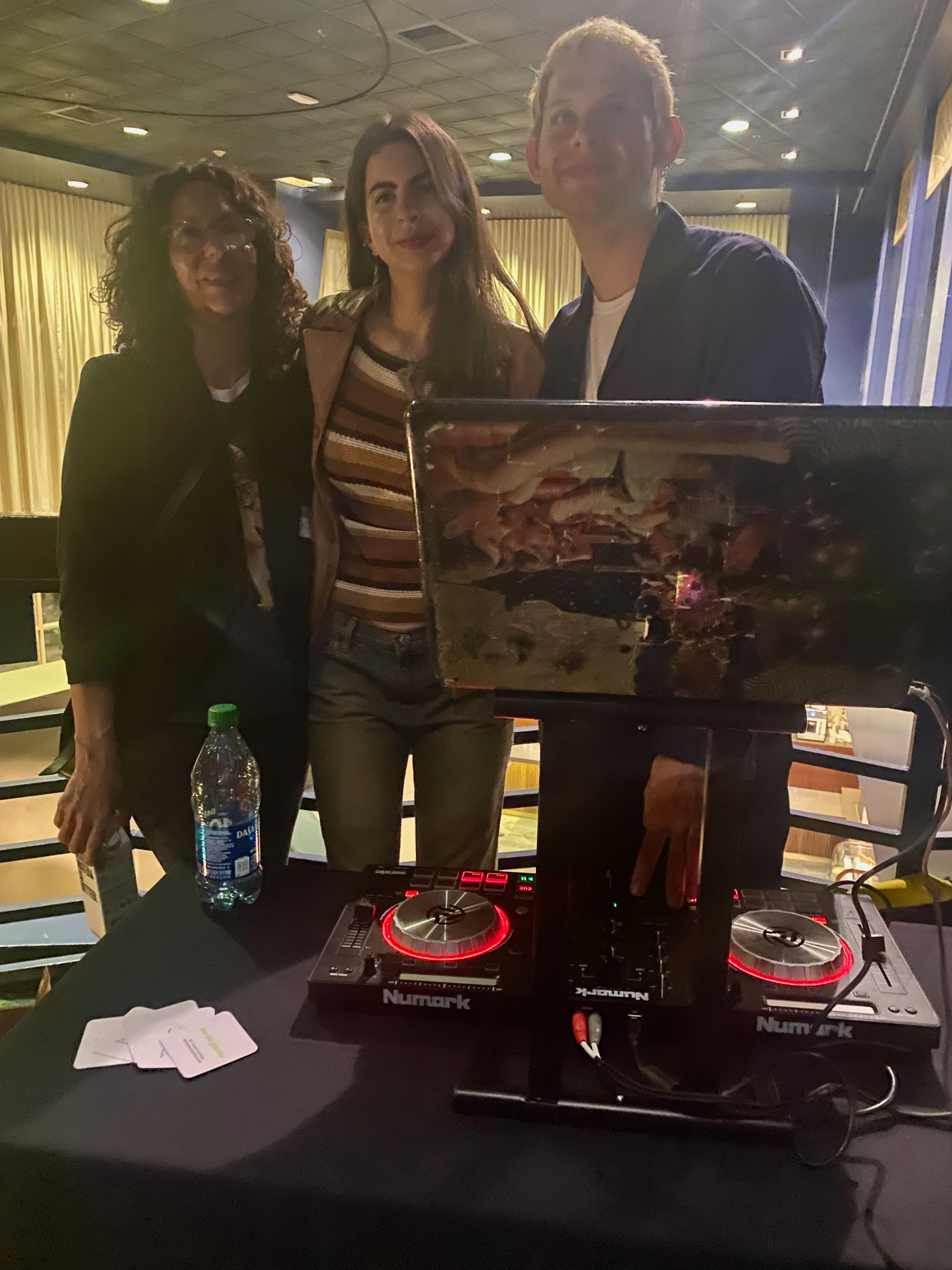 DJ HVN'S MOUTH and fans on the Mezzanine at the Culver Theater for WordPress Los Angeles' #WP20 celebration. Sponsors & Supporters at Hi-Tops. Popcorn and beverages.